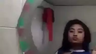 Beautiful desi girl lifting top to reveal sexy boobs