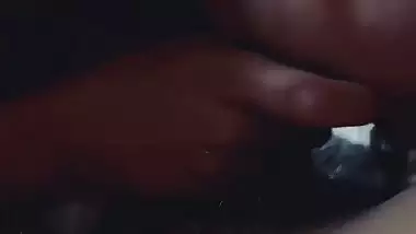 Slim girlfriend smiling while giving handjob and blowjob